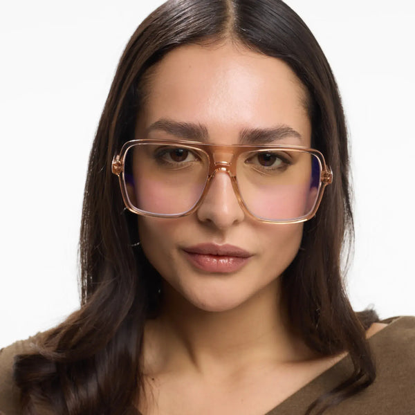 Barner Jake Glossy Rose Glasses Woman wearing glasses with a neutral background