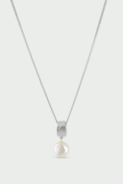 Tutti & Co Freshwater Pearl Necklace in Silver A silver chain necklace with a textured silver cap holding a single round, lustrous white pearl pendant, shown against a light gray background.