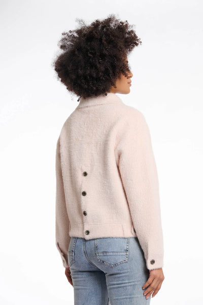 Rino & Pelle Bubbly Boxy Jacket in Pale Person wearing a light pink jacket with black buttons on a white background