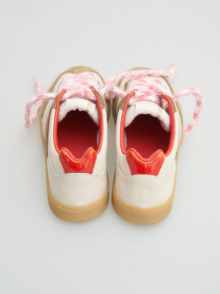 Serafini Copenhagen Vintage Trainer in Cream Leo Brown White sneakers with red soles and pink laces on a light gray background
