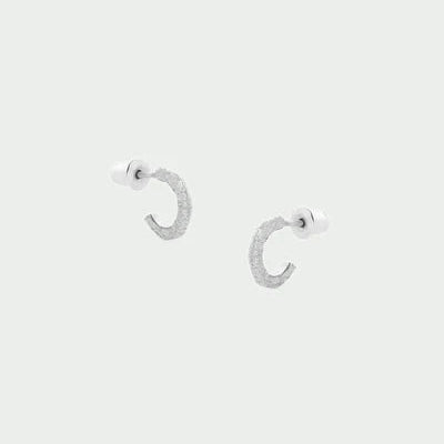 Tutti Aurora Earring in Silver Silver hoop earrings on a light gray background
