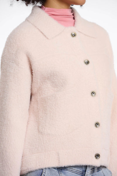Rino & Pelle Bubbly Boxy Jacket in Pale Close-up of a light pink cardigan with button details on a neutral background