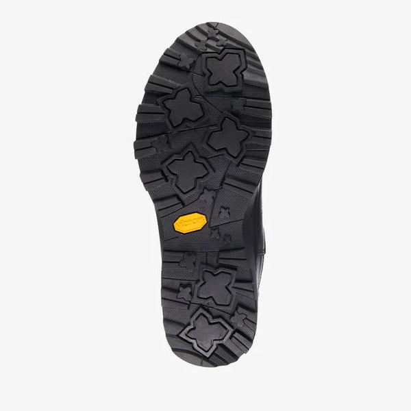 Emu Australia Woodroffe in Black W13095 Close-up of a black shoe sole with a yellow label on a white background