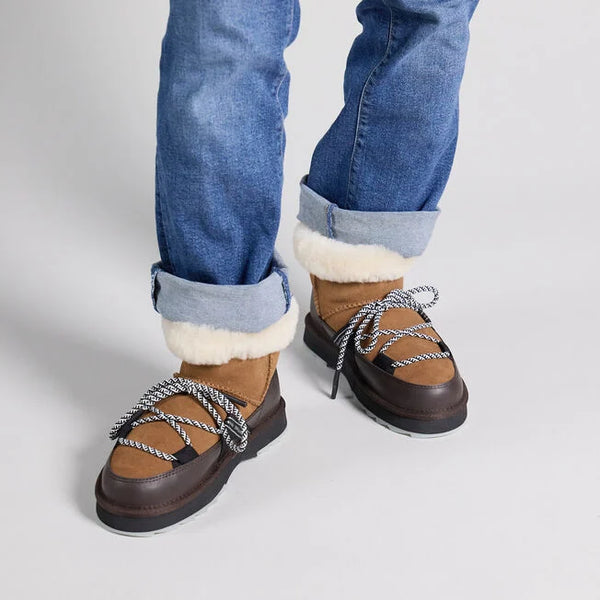 Emu Australia Blurred Micro in Chestnut W13129 Brown winter boots with white fur lining worn with rolled-up blue jeans on a light gray background