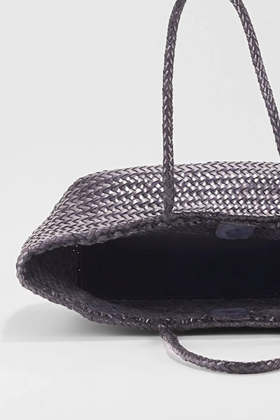 Ellyla Amora Woven Shoulder Bag in Dark Blue Close-up of a woven handbag with a plain background