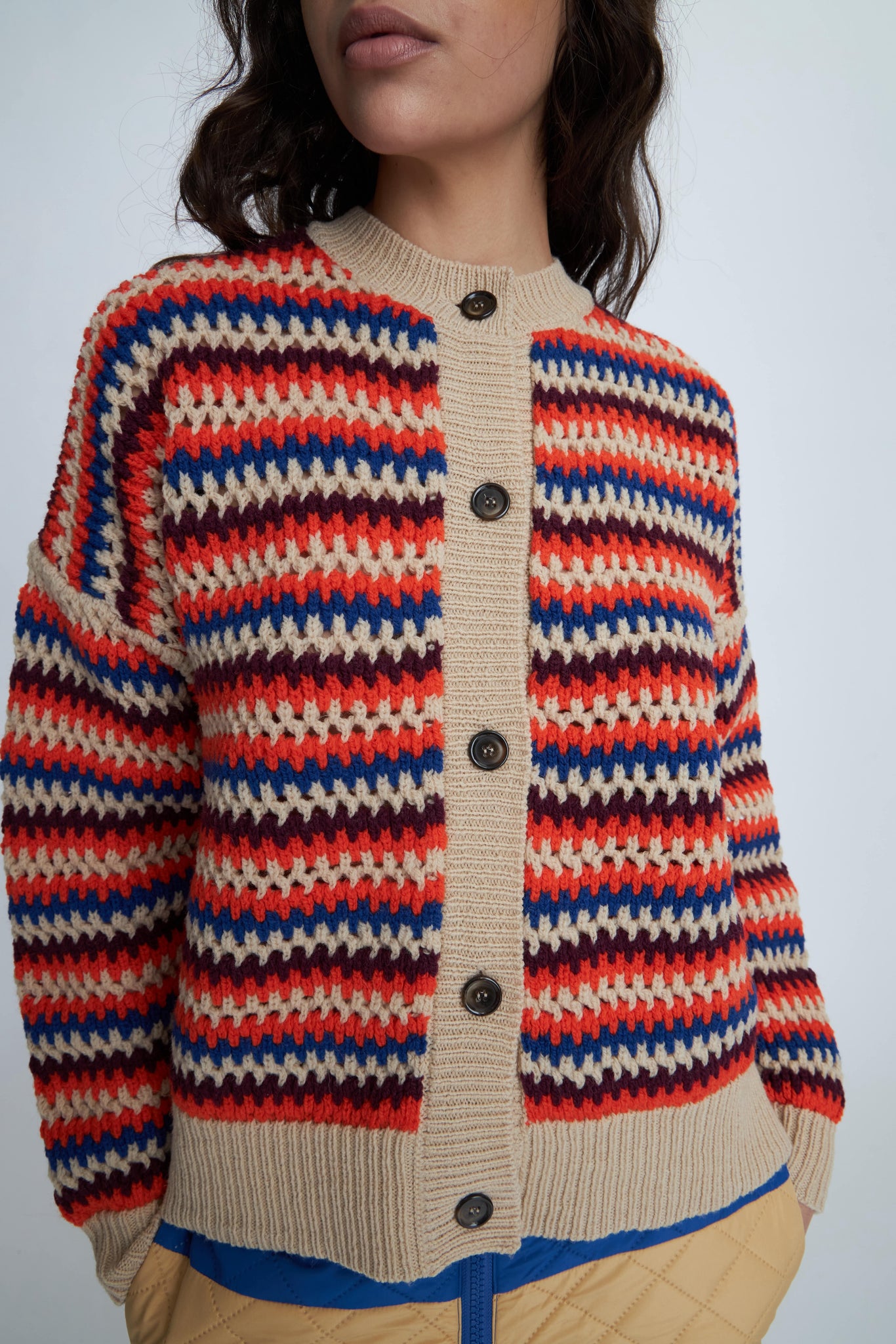 Stella Nova Italian Wool Knit Cardigan. Made with high-quality Italian wool, this knit cardigan features a modern striped pattern, button closure, and ribbed edges for a touch of sophistication. Enjoy a comfortable, relaxed fit with a classic round neck and long sleeves.&nbsp;