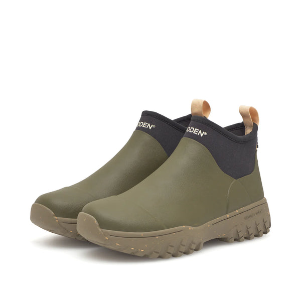 Woden Irene Waterproof Boot in Dark Olive Pair of green rubber boots with black accents on a white background