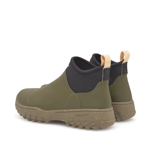 Woden Irene Waterproof Boot in Dark Olive Pair of green rubber boots with black accents on a white background