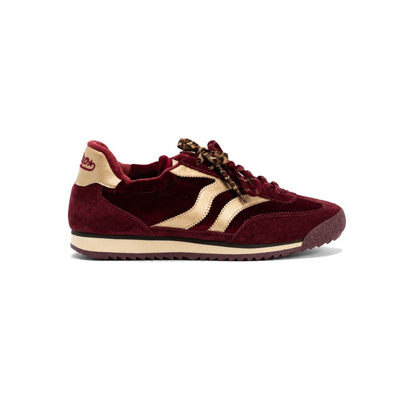 MRP Utah Trainers in Burgundy A single vintage-style platform sneaker in burgundy suede and beige synthetic material, featuring leopard-print laces and a cream platform sole, shown from a side profile on a white background.