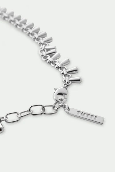 Tutti Dewdrop Necklace in Silver Silver chain necklace with a 'TUTTI' tag on a white background