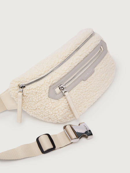 Varley Kansa Sherpa Belt Bag in Sandshell. White fleece waist bag with zippers.