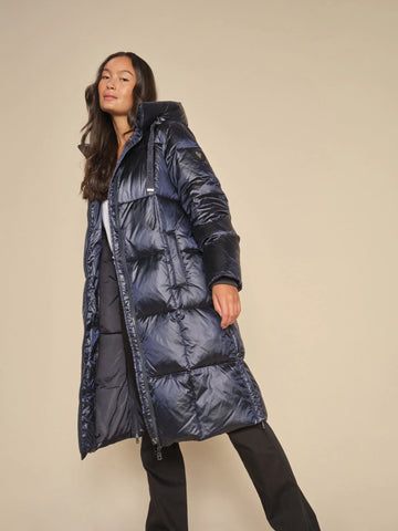 Stay warm and stylish in the Mos Mosh Nova Metallic Navy Blue Down Coat. With a cool metallic fabric and heavy zipper, this lightweight coat will keep you cozy in the cold. The long fit, high collar, and side slits provide added flexibility. 