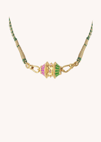 Introducing our BIG TALISMAN FUCHSIA/GREEN necklace from MYA-BAY. Inspired by traditional Indian jewels, this 24-carat fine gold necklace is an explosion of color and style. Adorned with fuchsia and green enamel, it features a green and gold cord woven in India and fastens with two small carabiners for added charm and practicality. Wear it two ways for ultimate versatility.

CO-272 G