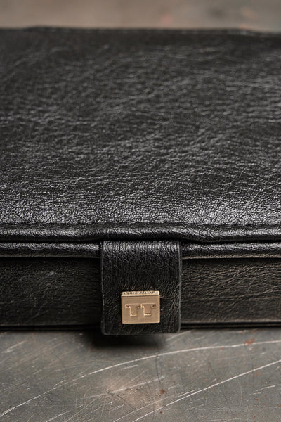 Tutti Tide Mini Jewellery Box Black jewelry box with a gold logo on a white background